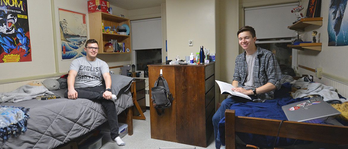 Students in a Scott Hall - North residence hall room