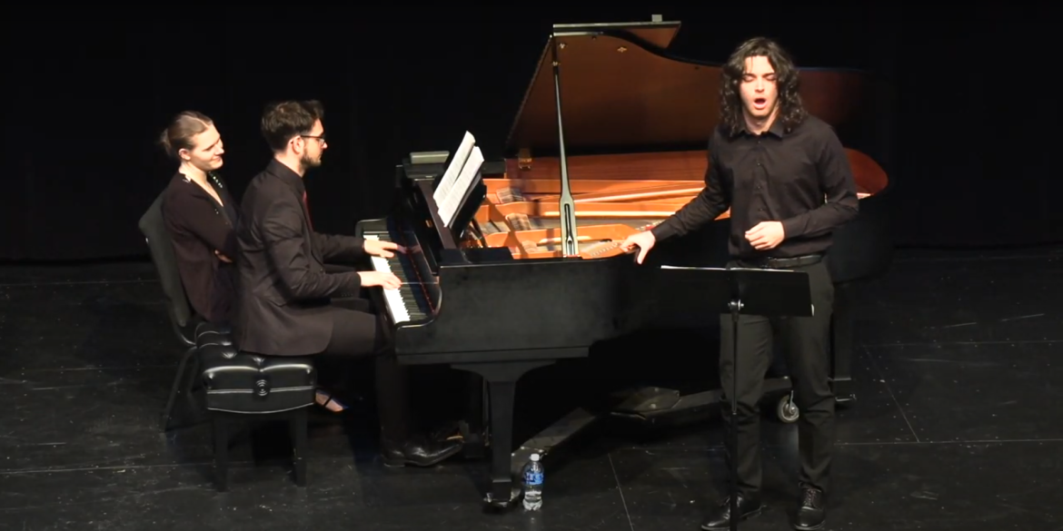 3 people performing music at or near a piano