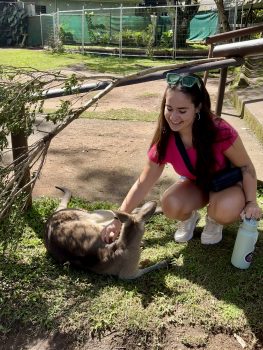 UMF Student with marsupial in Australia