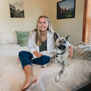 UMF student, Bridget Stephenson, first student winner of the University of Maine System’s Shot Clock Scholarship, and her dog Aspen.