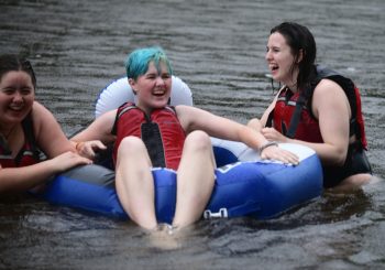 Students relax and make friends while tubing in the Sandy River.