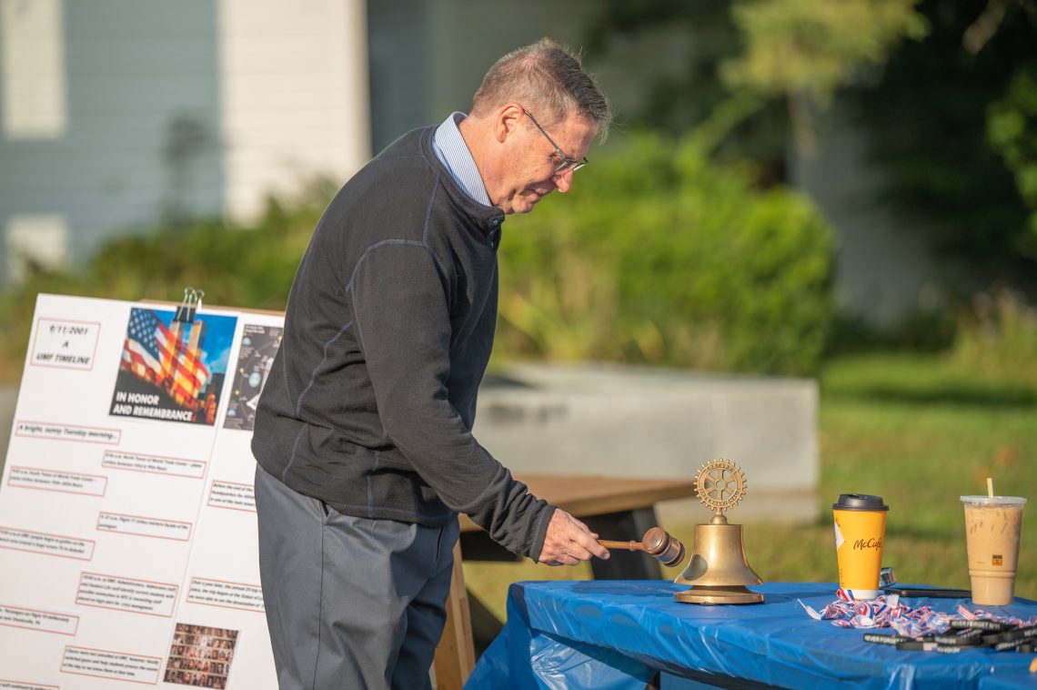 UMF President Joseph McDonnell rings the bell in remembrance of those lost on 9/11.