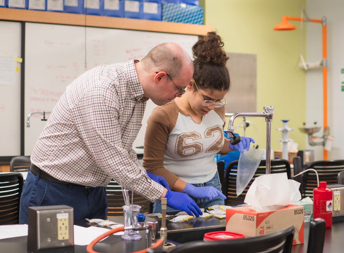 Dr. Timothy Breton, UMF associate professor of biology working with student research assistant